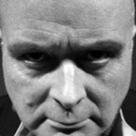 John Burns as Aleister Crowley